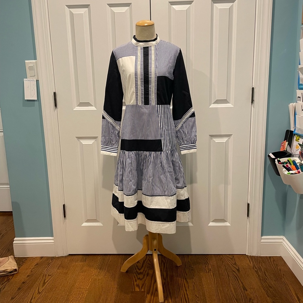 Blue and white color block and stripe dress with eyelet details.